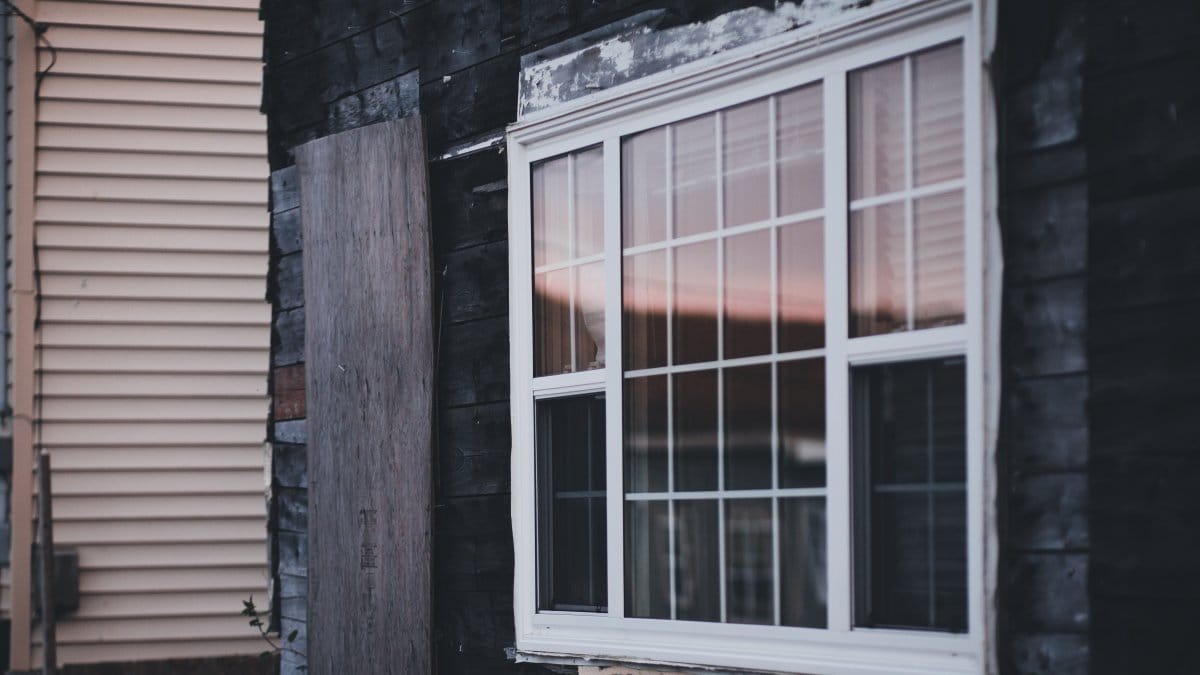 Wooden house facade with a window